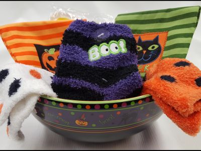 Ceramic Halloween Bowl from Longaberger, Fuzzy Socks, and Kitchen Towels