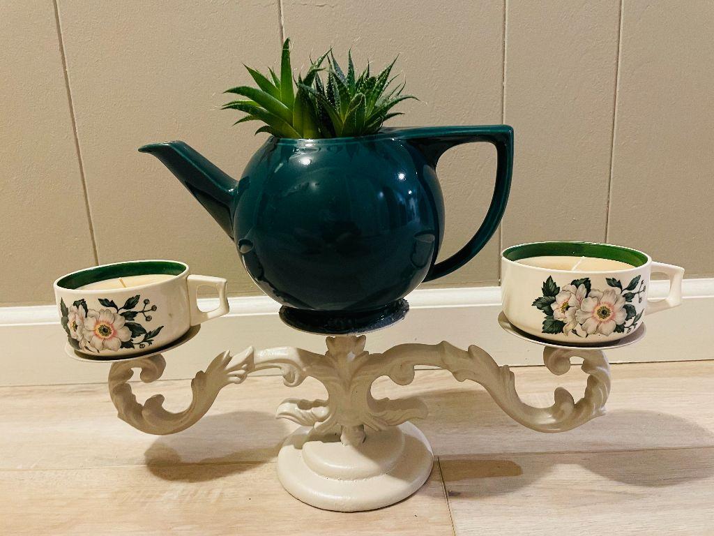 A succulent tea pot and candles