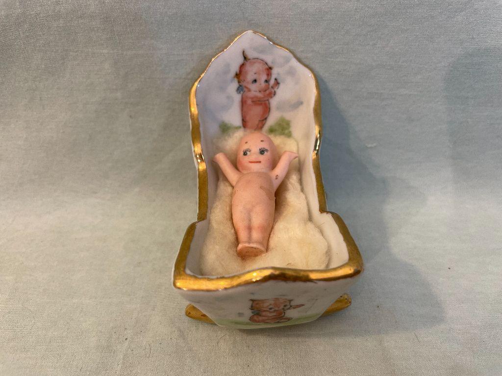 Baby Doll in Ceramic Cradle