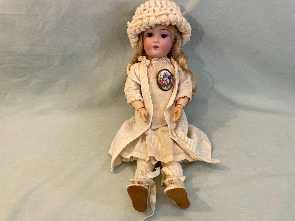 Doll with Brooch and Knit Cap