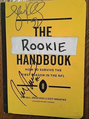 The Rookie Handbook autographed by Luke Kuechly and Coach Rivera