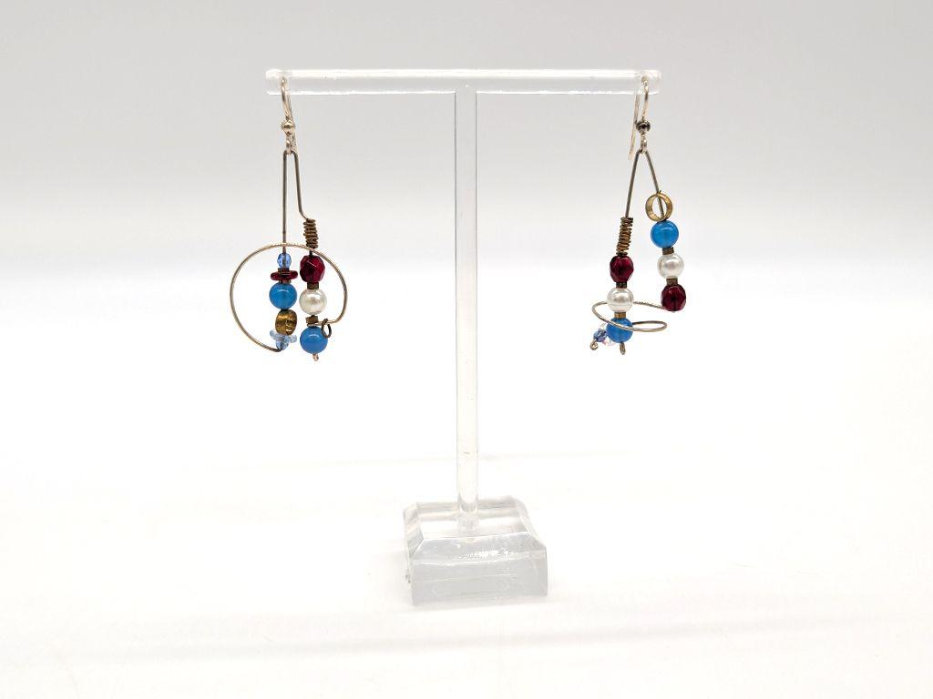 ''Asymmetrical Earrings'' by Brian Watson
