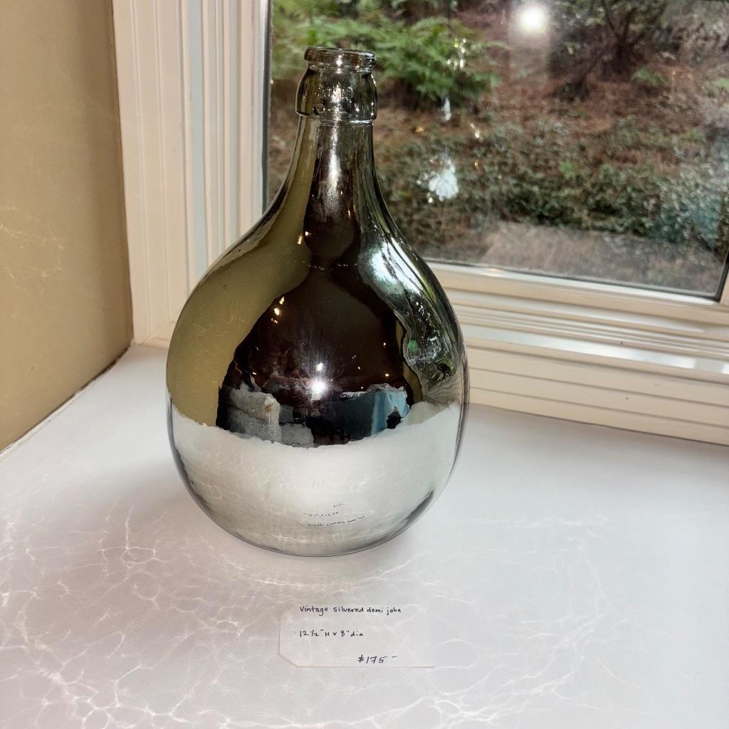 Vintage silvered Demi john donated by The Hunt Shop