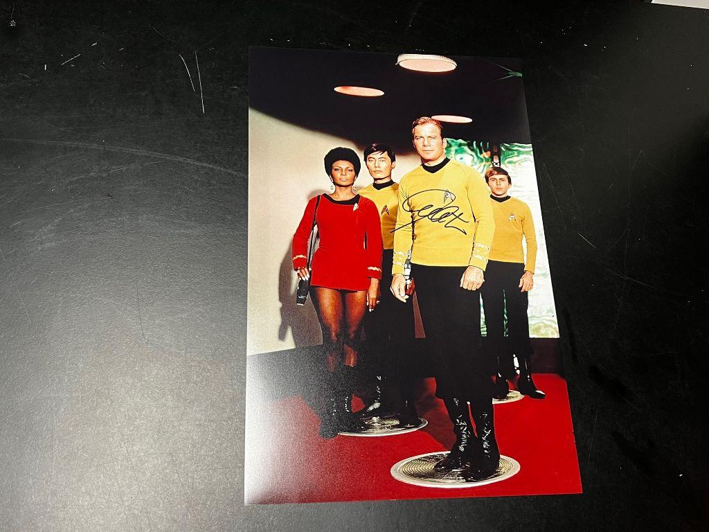 Photo of Kirk, Uhura, Sulu and Chekov autographed by...