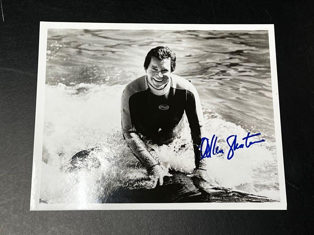 Black and White Photo of William Shatner riding a wh...