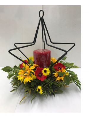 Wrought Iron Star with Candle and Floral Arrangement